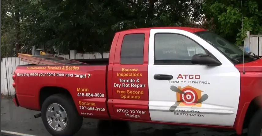 "ATCO Termite Control truck parked, advertising pest inspection services and termite repair in Petaluma."