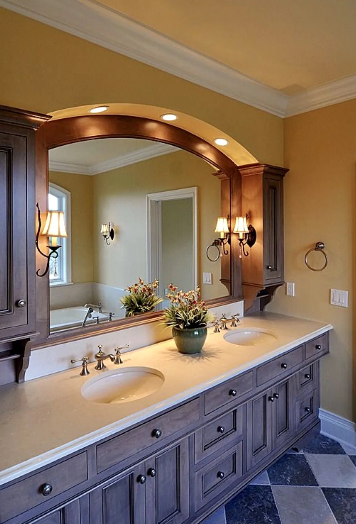 A well-designed bathroom featuring a double sink vanity with an arched mirror and elegant lighting, showcasing the craftsmanship of Able Glass Company in Santa Clara.