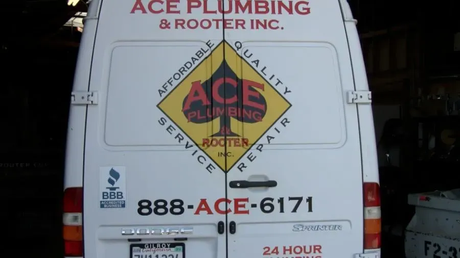 Rear view of an Ace Plumbing and Rooter Inc. van in San Francisco, displaying company logo and contact information.