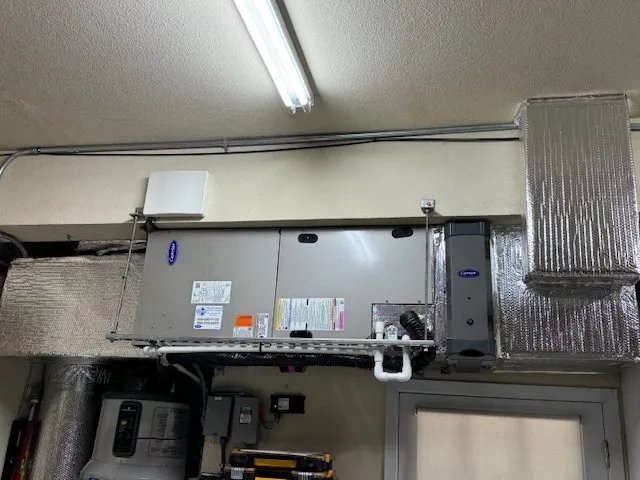 Image showing an installed HVAC unit with insulated ductwork and components, highlighting a professional installation by Air Quality Heating & Air Conditioning in San Jose.