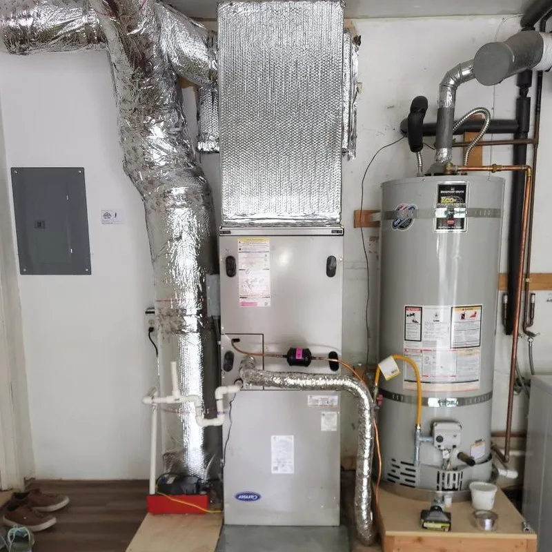 A heating system setup with an insulated duct installation and a water heater in a residential setting, showcasing AllBayInsulation&HVAC's work in SanJose.