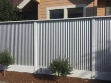 A metallic fence in front of a house, built by Arbor Fence, Inc. in Sonoma.
