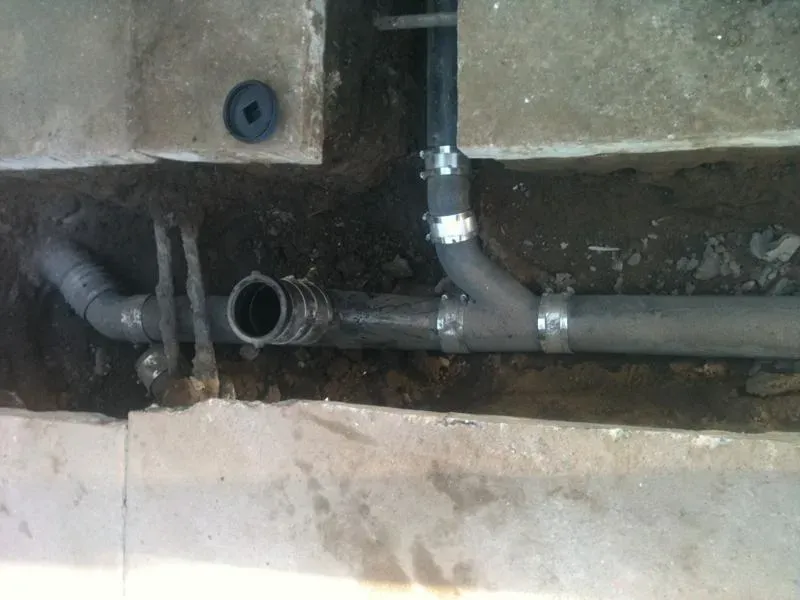 Close-up view of underground plumbing pipes being installed, featuring joints and connections, by Atlas Plumbing & Rooter in San Francisco.