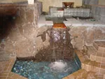 Caption: Experience the epitome of design and craftsmanship with BB & B Builders Inc. in Mendocino, where this stunning indoor waterfall showcases functionality and aesthetic precision.