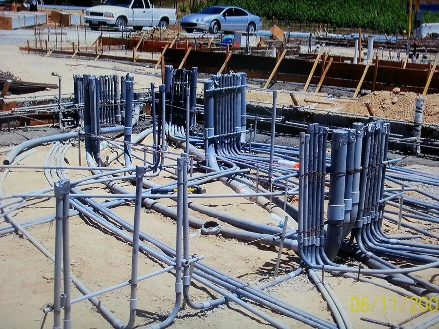 "Electrical conduit installation at a construction site by B. Henry's Quality Electric Inc. in Petaluma, with visible pipes and groundwork setup."