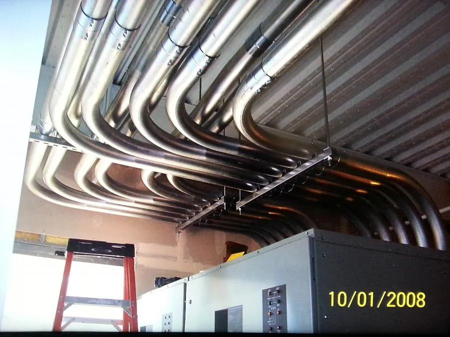 "A complex conduit system installed on a ceiling by B. Henry's Quality Electric Inc. in Petaluma, showcasing precise bends and alignment."