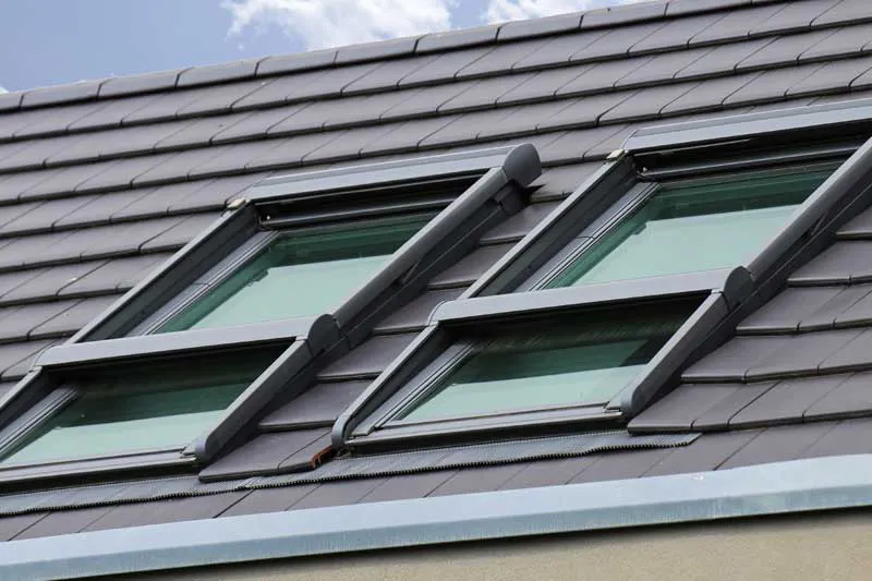 Two skylight windows installed on a tiled roof, showcasing the craftsmanship of B & L Glass in Santa Rosa.