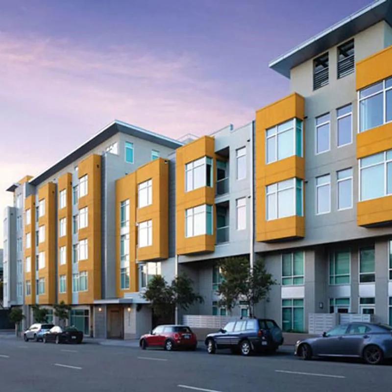 A modern multi-story building with large, stylish windows in Santa Rosa, featuring glass work by B & L Glass.