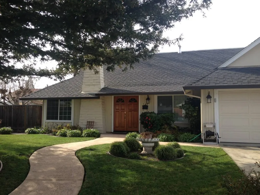 "A neatly maintained suburban home with a well-constructed roof, showcasing the quality work of Bay Valley Roofing in Concord."