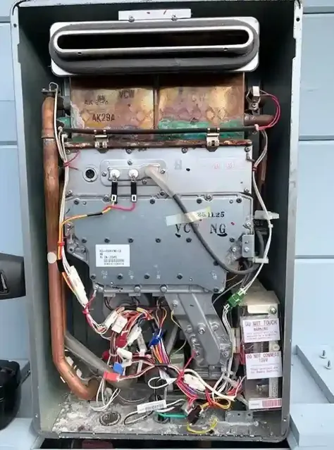 An image showing the internal components of a water heater, featuring wires and metal parts, provided by Better Water Heaters, Inc. in San Jose.