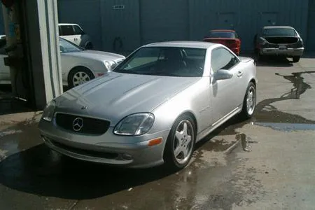 A silver Mercedes-Benz parked at Coelho's Body Repair and Auto Sales in Fremont.