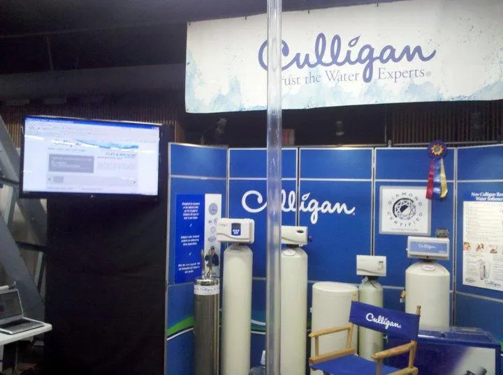 Display booth of Culligan Water of Sonoma County in Santa Rosa, featuring water treatment equipment and informational signage.