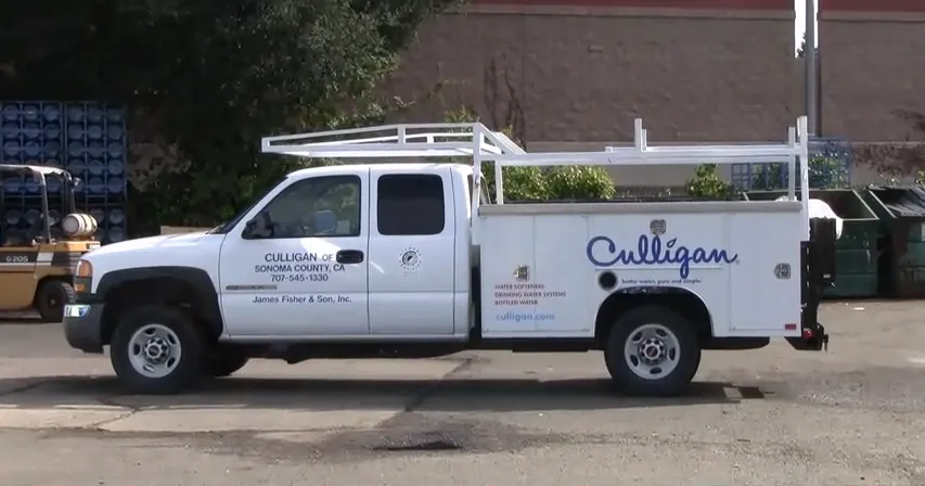 "A white service truck from Culligan Water of Sonoma County, parked in Santa Rosa, with company branding and contact information on the side."