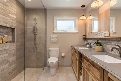 Modern bathroom with a walk-in shower, dual sinks, and wood cabinetry by D.R. Domenichini Construction in Morgan Hill.