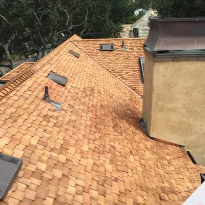 A well-constructed shingle roof on a residential building, demonstrating the quality work of Daddario Roofing Company, Inc. in Capitola.