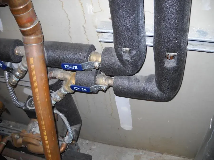 Insulated HVAC pipes with blue valve handles, installed by Degree HVAC, Inc. in Redwood City.