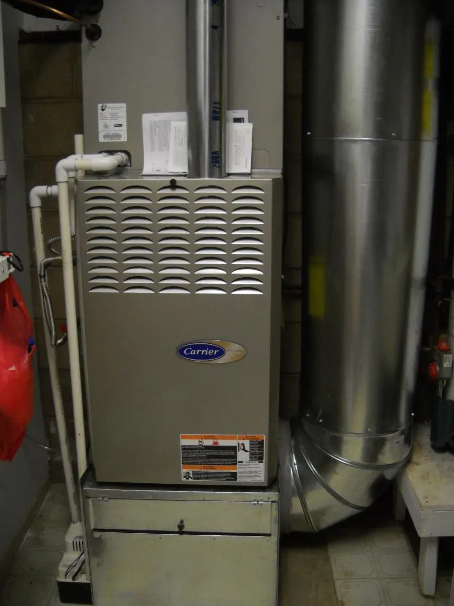 A Carrier furnace installed with ductwork, showcasing HVAC setup by Degree HVAC, Inc. in Redwood City.