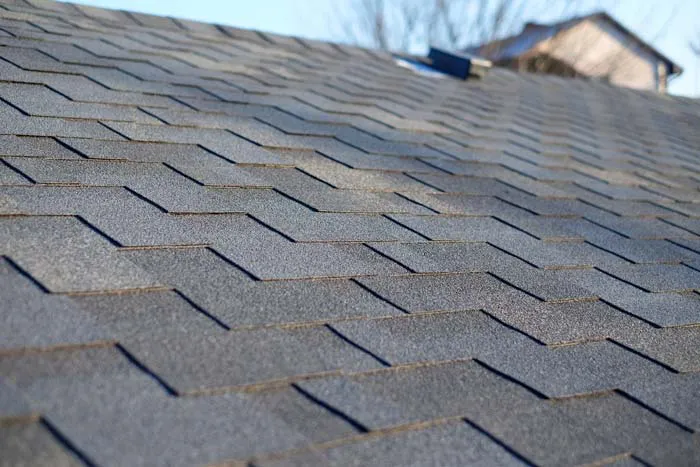 Close-up of a neatly aligned shingle roof installed by Dynamic Roofing Inc. in Antioch, featuring a uniform and durable design.