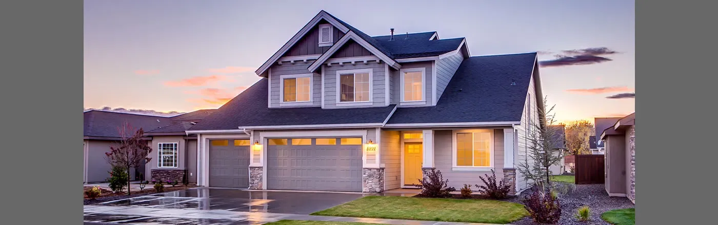 A modern two-story house with a well-maintained roof at sunset in San Mateo, serviced by EdgeRoofing.
