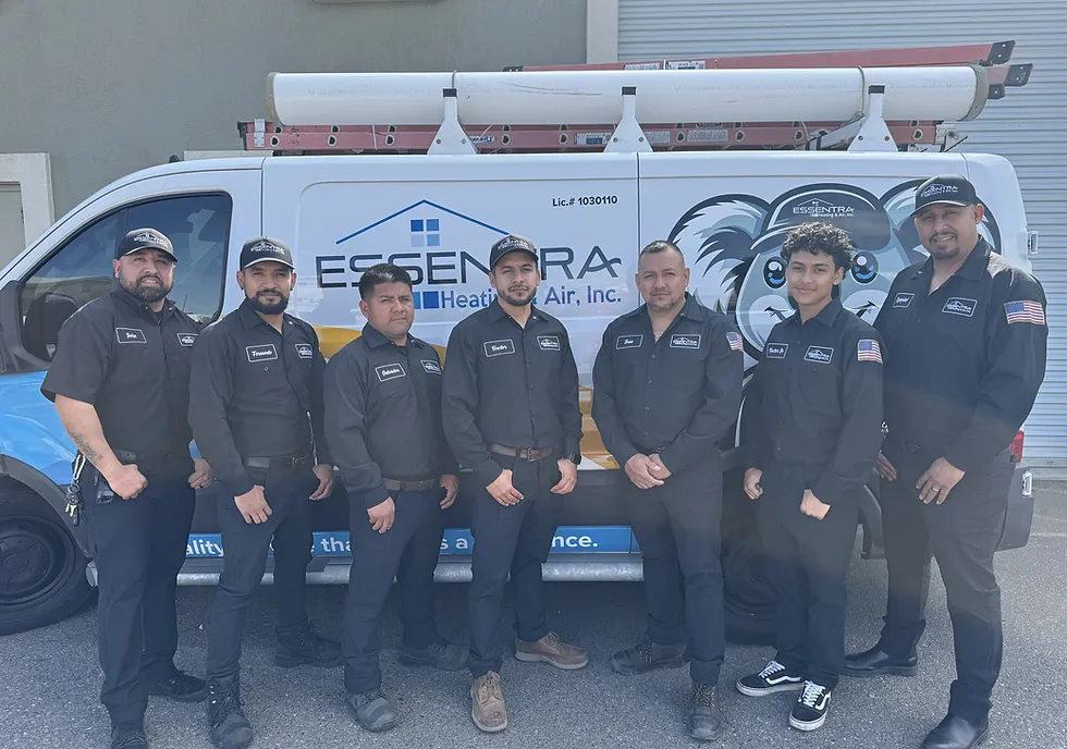 A group of seven technicians in uniform standing in front of a service van, representing teamwork and professionalism.