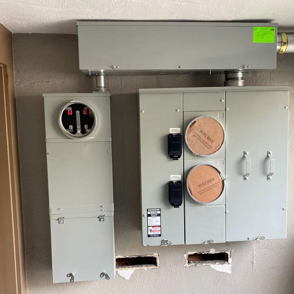 "Electrical panel installation by Electro-Integrity in San Francisco, featuring circuit boxes and wiring connections."
