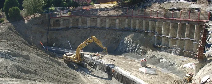 A construction site in Walnut Creek featuring heavy machinery from Engineered Soil Repairs, Inc., working on a large-scale foundation and soil stabilization project.