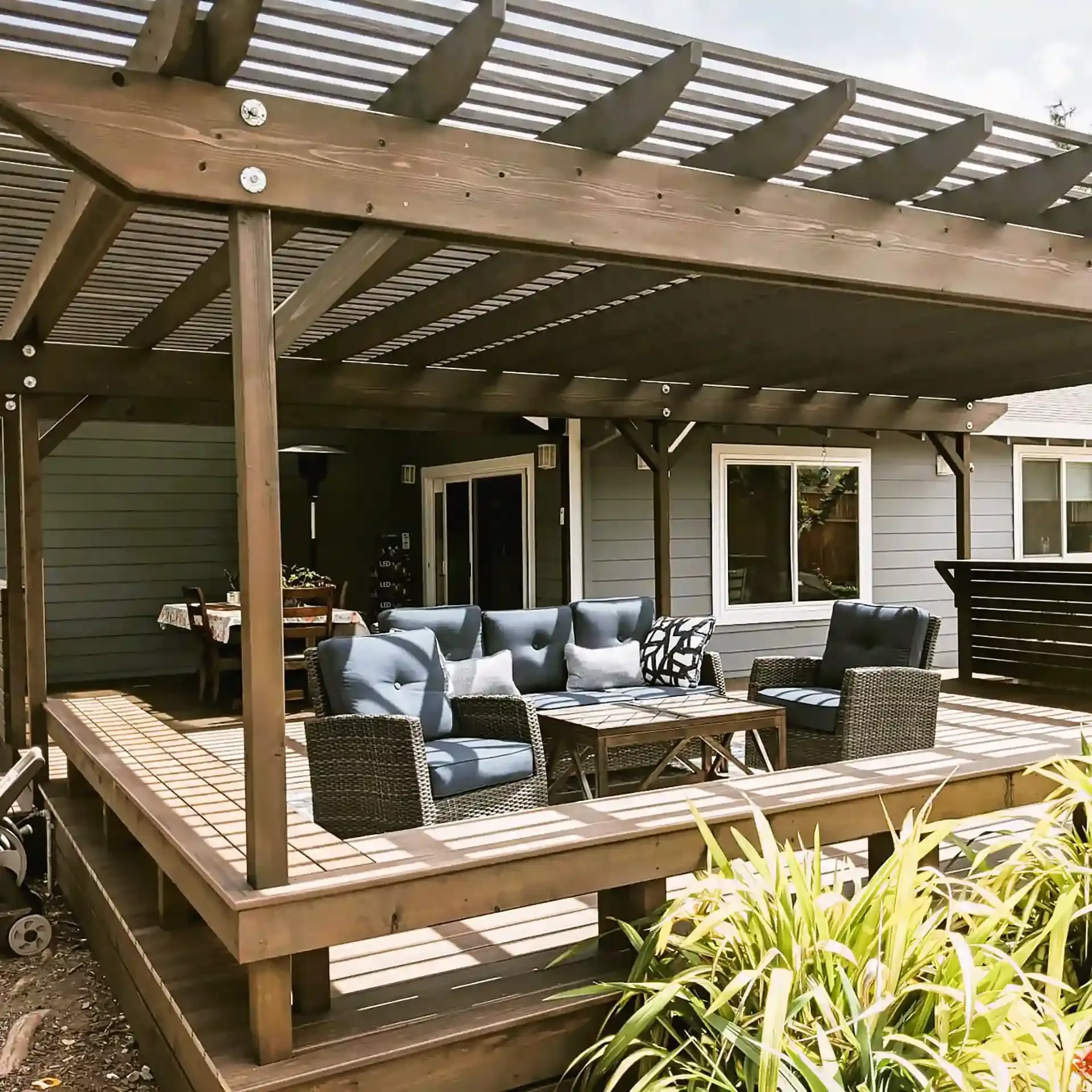 Image of a well-designed pergola with comfortable outdoor seating, constructed by Farrar Construction Inc. in Petaluma.