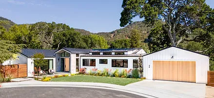 A modern home with a well-manicured lawn and vibrant landscaping by G Landscape Division, LLC in San Rafael.