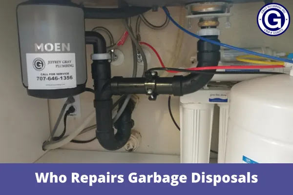 "Under-sink view showing plumbing components and pipes connected to a garbage disposal unit, with Gray Plumbing Inc service information visible."
