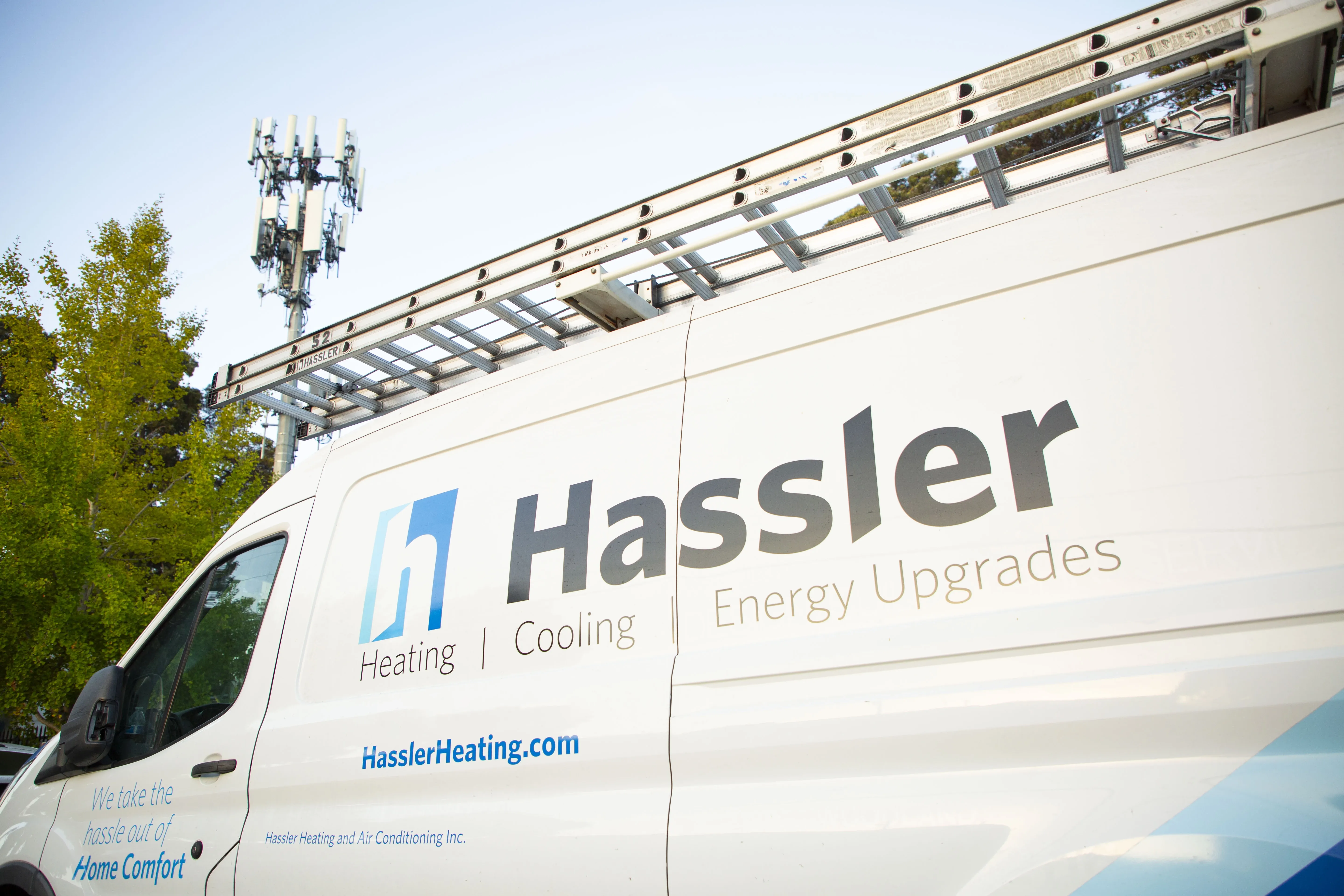 A Hassler Heating & Air Conditioning, LLC service van parked outdoors, highlighting the company's focus on heating, cooling, and energy upgrades in El Cerrito.
