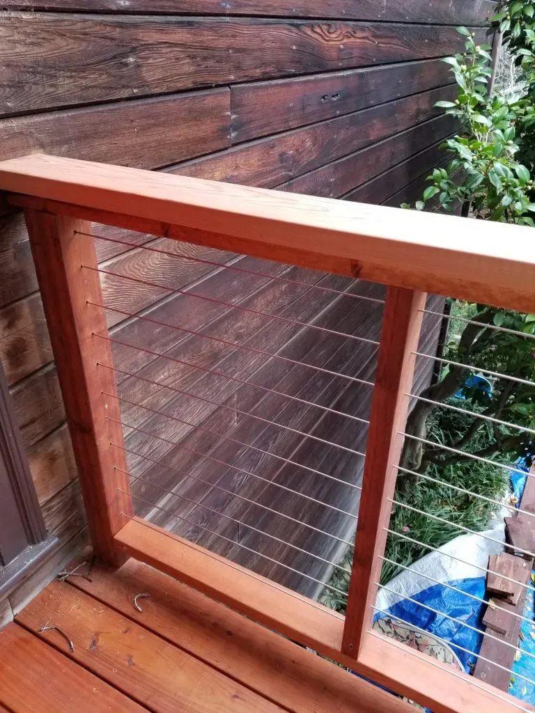 "A wooden deck railing and wall, demonstrating the craftsmanship protected by Hi Tech Termite Control of the Bay Area, Inc. in Hayward."