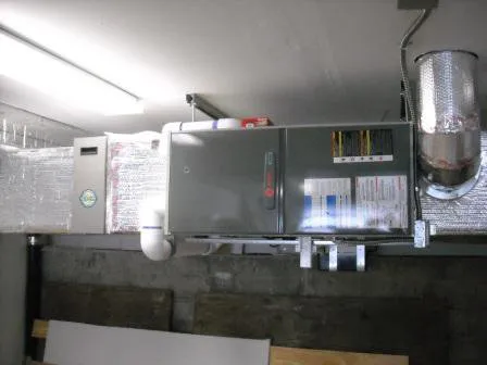 Image of an HVAC system installed in a room, featuring ducts and venting, representing the work of Innovative Mechanical, Inc. in South San Francisco.