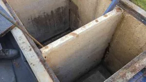 Image of a large, clean grease trap with dividers, part of Joe's Farmer Septic & Grease Services, Inc.'s maintenance work in Santa Rosa.