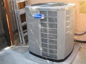 A large outdoor HVAC unit installed next to a building, representing reliable climate control solutions offered by Kelly Plumbing & Heating, Inc. in Novato.