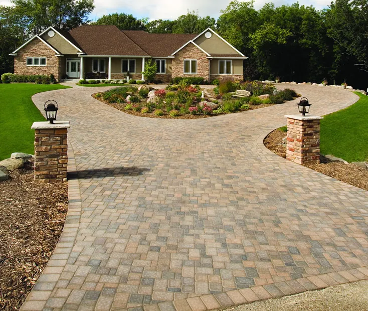 "A beautifully crafted brick driveway leading to a house, showcasing the precision and elegance of Kodiak Construction in Martinez."