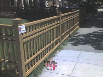 A well-constructed wooden fence by Meza'sFence in San Jose, showcasing quality craftsmanship along a sidewalk.