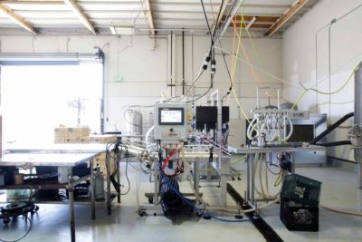 Interior view of Micah Electric Co. facility in Oakland, showcasing advanced machinery and equipment used in electrical manufacturing.