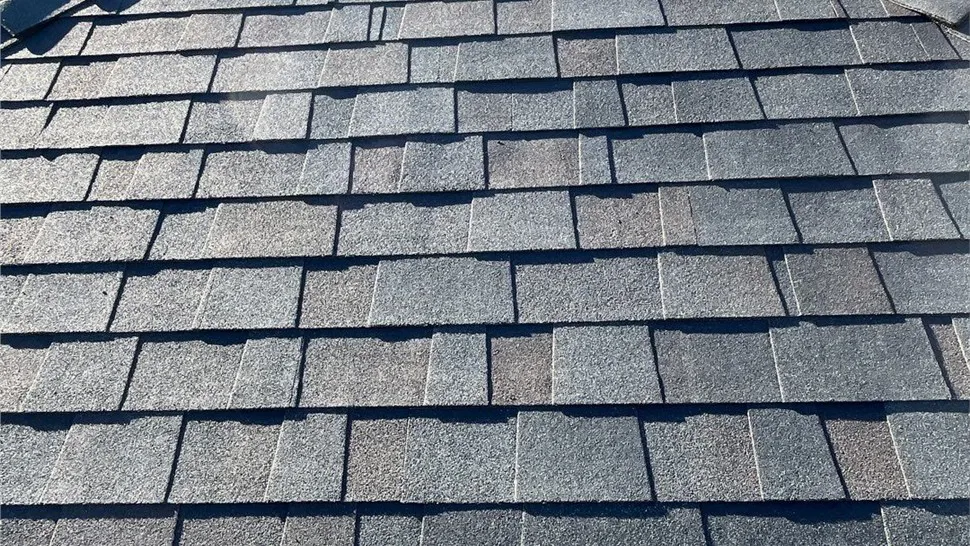 Close-up view of well-aligned, dark gray asphalt roof shingles installed by Mr. Roofing, Inc. in South San Francisco.