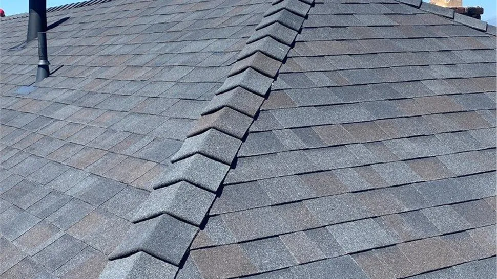 "Close-up view of a roof with gray shingles and a ridge vent, installed by Mr. Roofing, Inc. in South San Francisco."