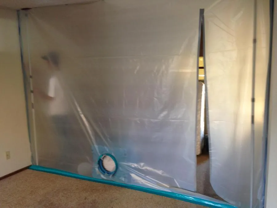 "A clear plastic containment barrier set up in a room, demonstrating NBE Property Restoration's restoration protocol in Santa Rosa."