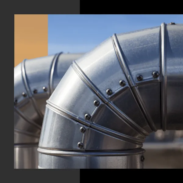 A close-up image of metal ductwork installed outdoors, showcasing Ortiz Heating and Air Conditioning's expertise in Burlingame.