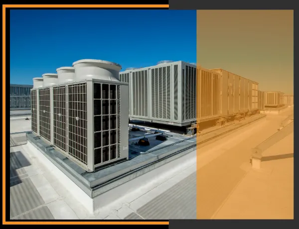 Industrial HVAC units on a rooftop under a clear blue sky, serviced by Ortiz Heating and Air Conditioning in Burlingame.