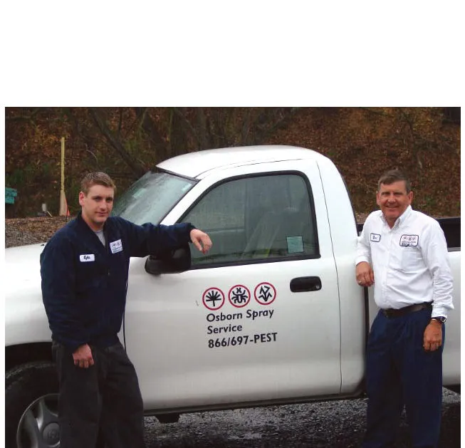 Two men standing beside a white truck labeled "Osborn Spray Service" in Danville, showcasing pest control services.