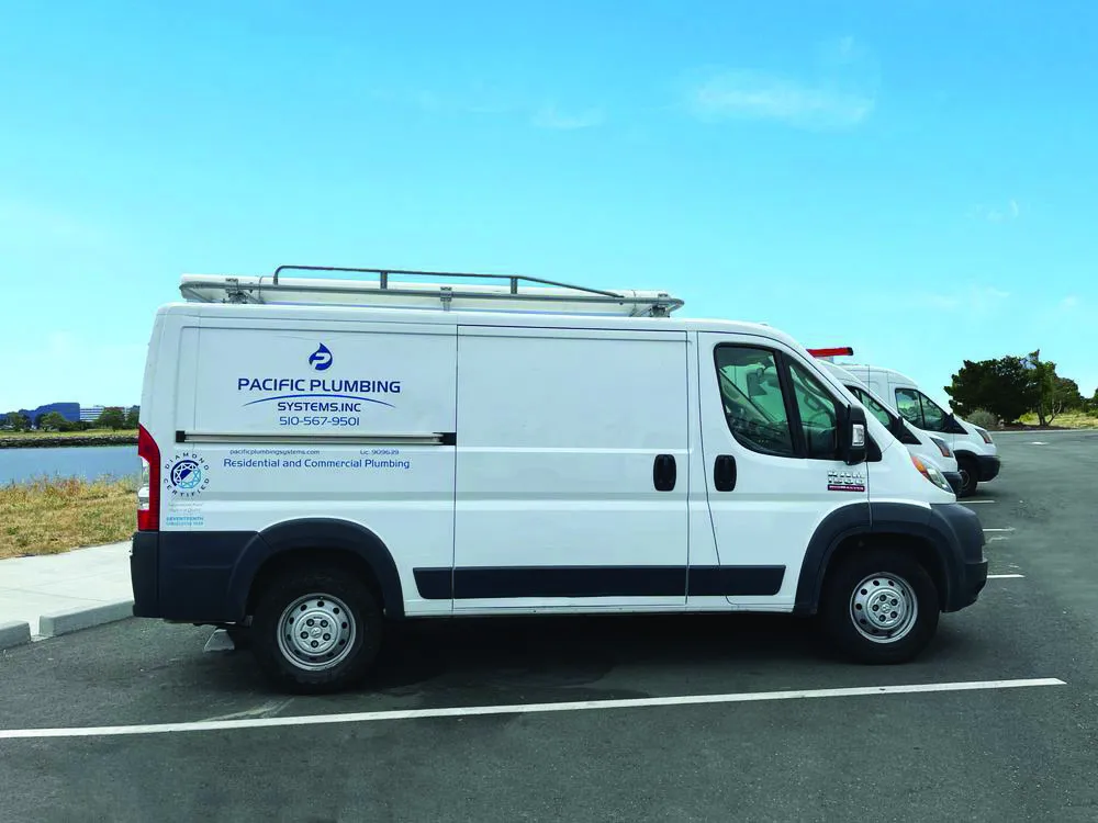 A Pacific Plumbing Systems van parked in a lot in San Leandro, showcasing their commitment to reliable plumbing services.
