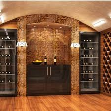 A modern wine cellar with wooden floors and mosaic-tiled walls, featuring shelves and a central cabinet with wine bottles, designed by Peninsula Design and Construction in Hayward.