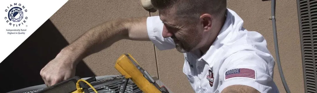 A technician from Perfect Star Heating and Air Conditioning working on an HVAC unit, demonstrating expertise in Concord.