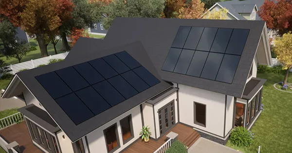 A modern house with solar panels installed on the roof, showcasing ROOFMASTERS' work in Suisun City amidst a backdrop of trees and neighboring homes.