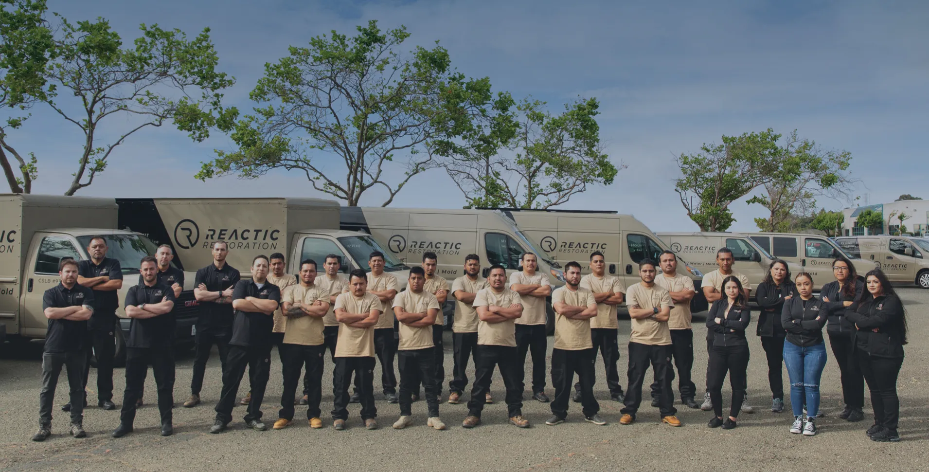 A team of professionals from Reactic Restoration, standing in front of company vans, ready to serve San Pablo.