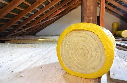 A roll of insulation material in an attic space, highlighting Roof-Life Construction's work in San Ramon.