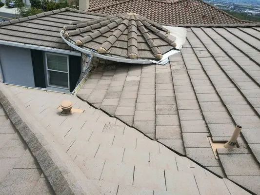 Overhead view of a residential roof with a complex angular design, featuring various rooflines and shingle patterns, showcasing the expertise of Roof-Life Construction in San Ramon.